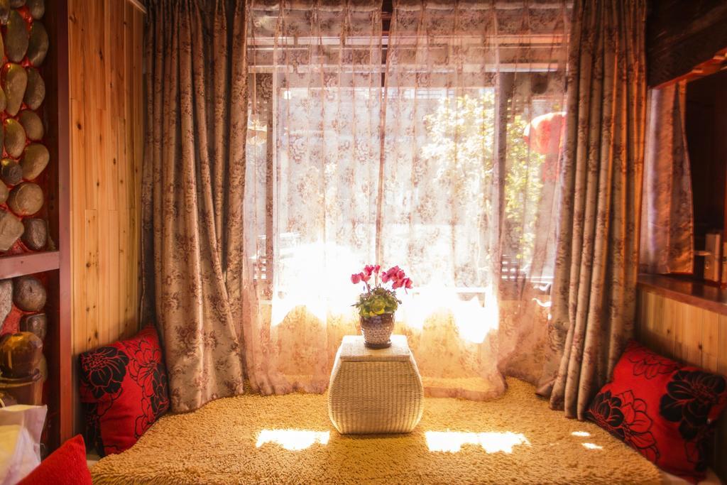 Отель Secret Garden Лицзян Номер фото